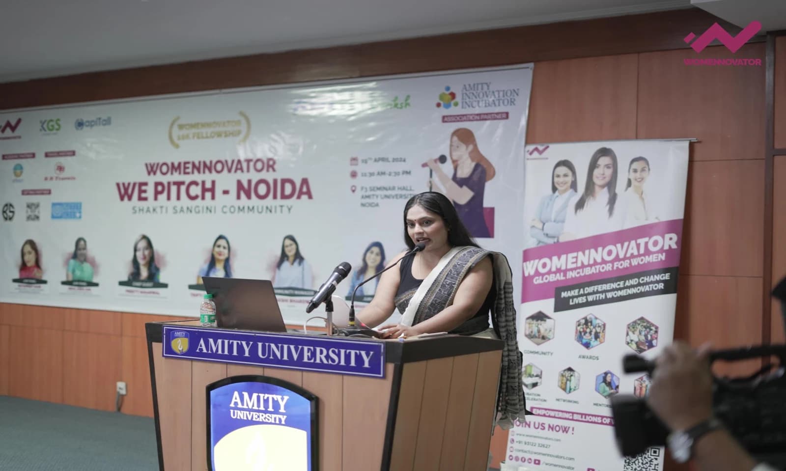 Woman presenting at a WE PITCH event