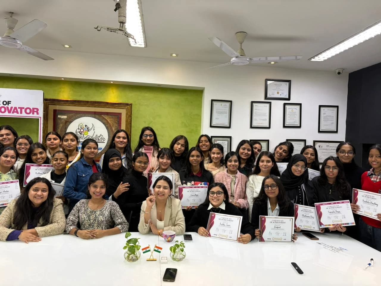 Womennovator community members gathered for a certificate presentation.